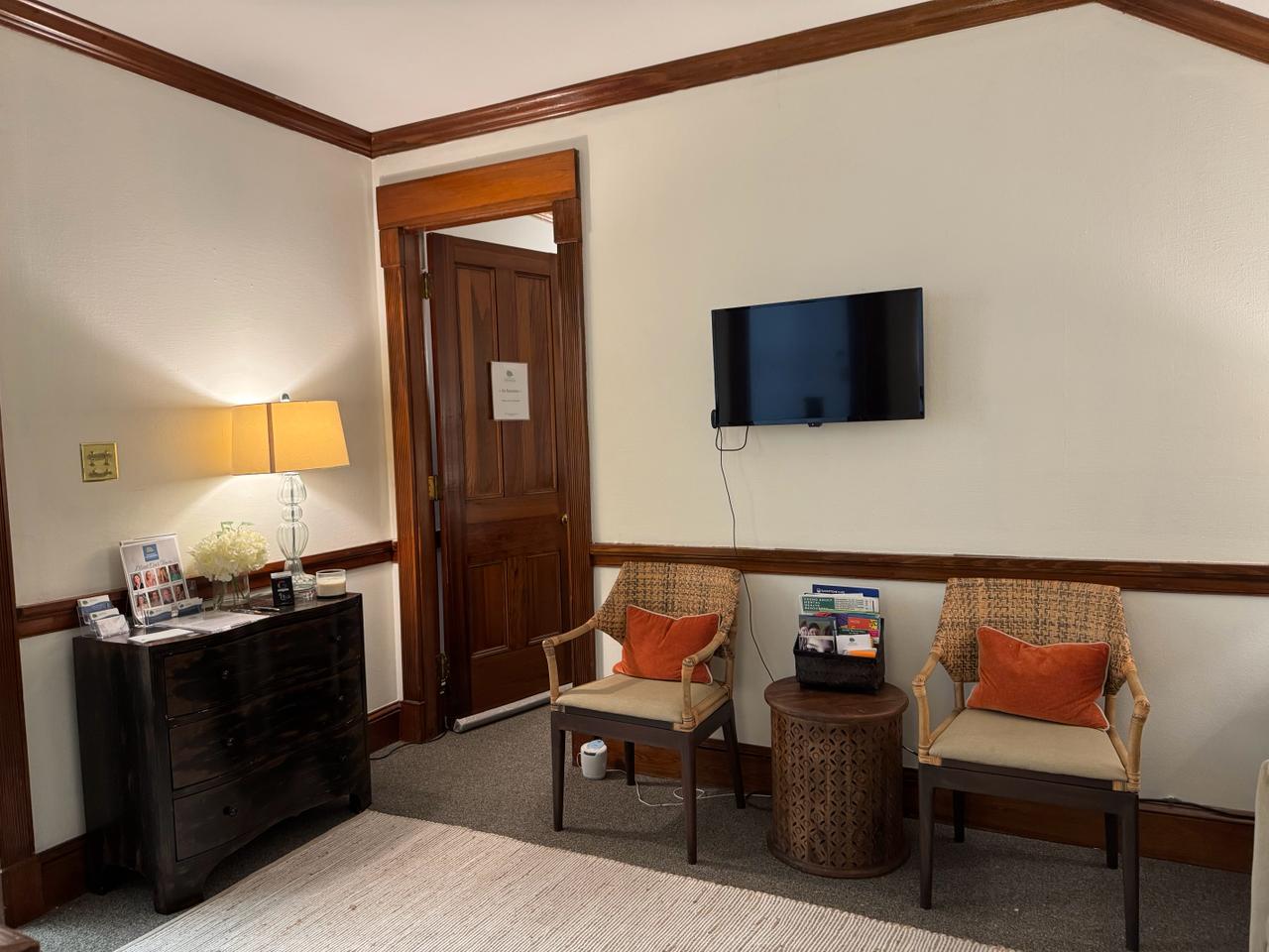 Comfortable waiting area with chairs and warm lighting at Brandon Reeves, LCSW therapy office in Baton Rouge